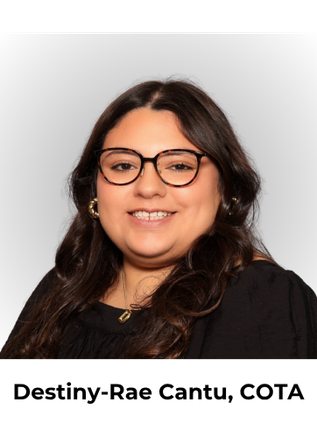 A person with long dark hair, wearing round glasses and a black top, smiles gently against a light gray background.